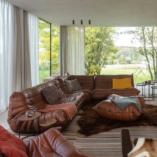 Plush leather loveseat sofa with low-profile two-seater design in brown top-grain leather