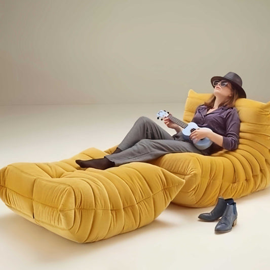 Caterpillar Lounge Chair and Footstool set in cozy upholstered fabric with curved design