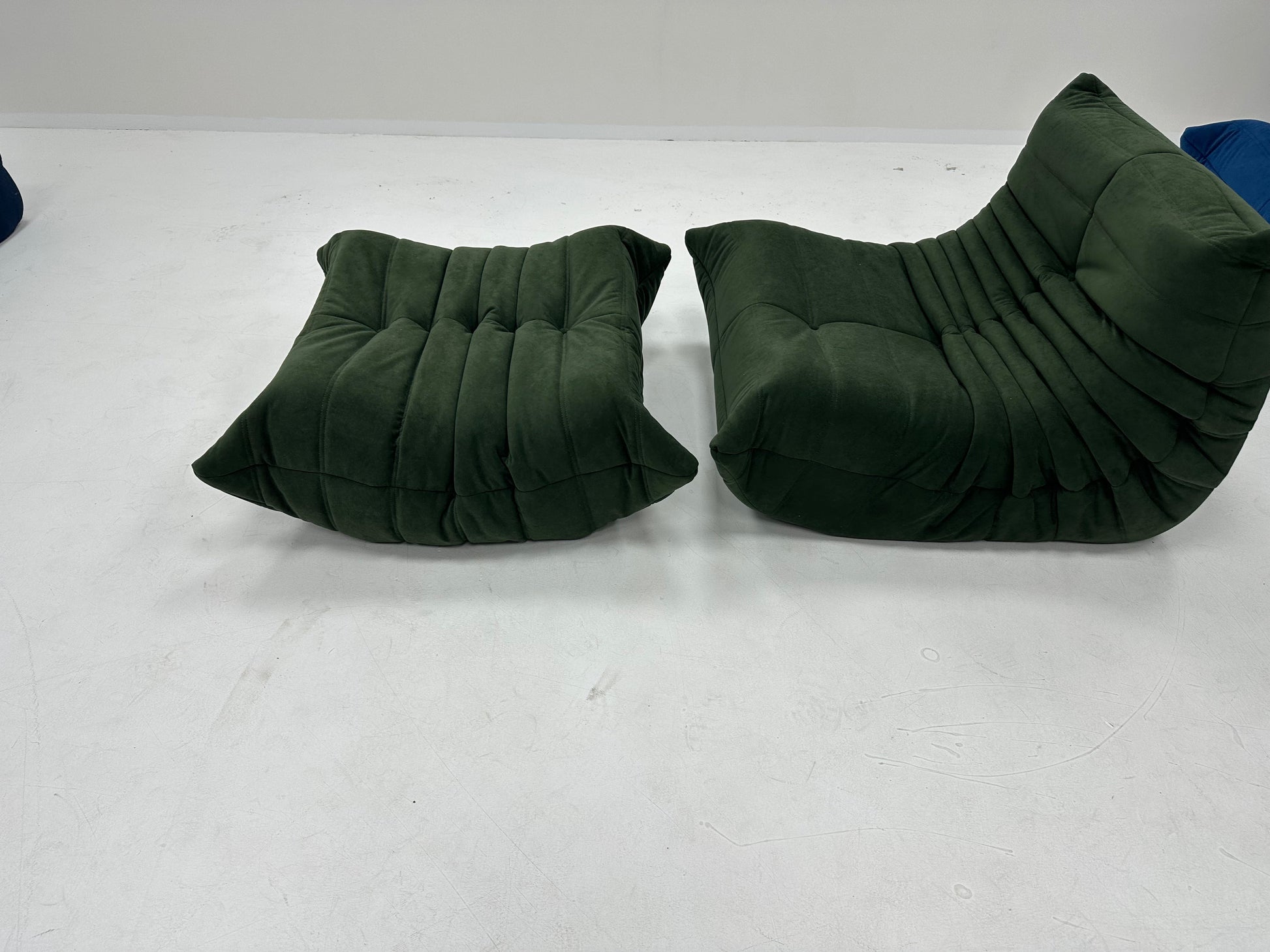 Caterpillar Lounge Chair and Footstool Set in cozy beige suede upholstery with curved, all-foam cushioned design