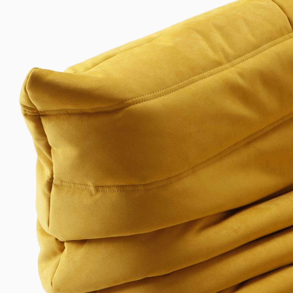 Luxury Caterpillar Velvet Ottoman Footstool in soft velvet with ergonomic caterpillar design