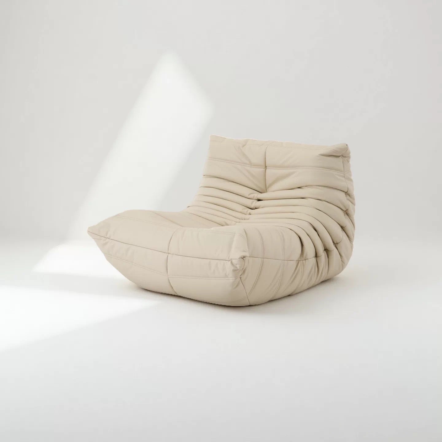 Caterpillar Lounge Chair armless fabric seat in multiple colors with wave-like design and high-density foam cushioning