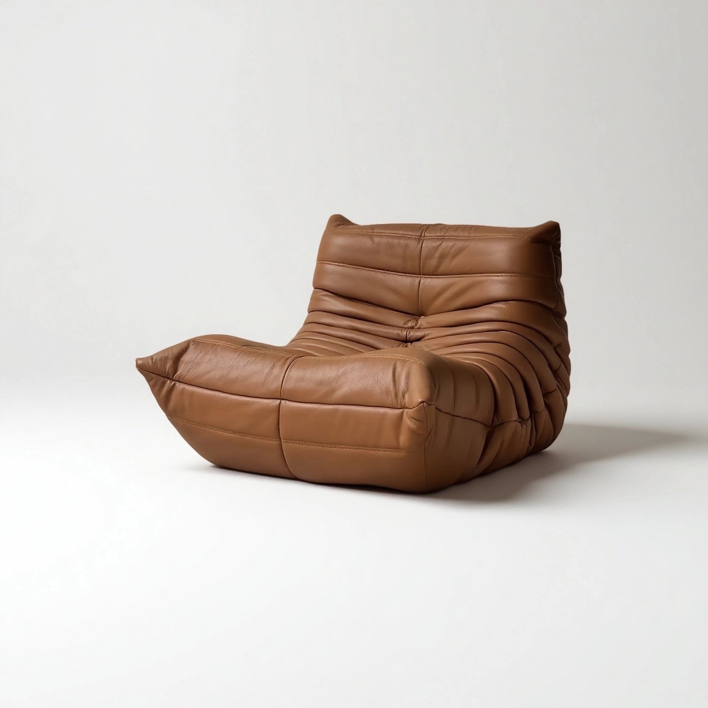 Caterpillar Lounge Chair armless fabric seat in nine colors with wave-like design and high-density foam cushioning