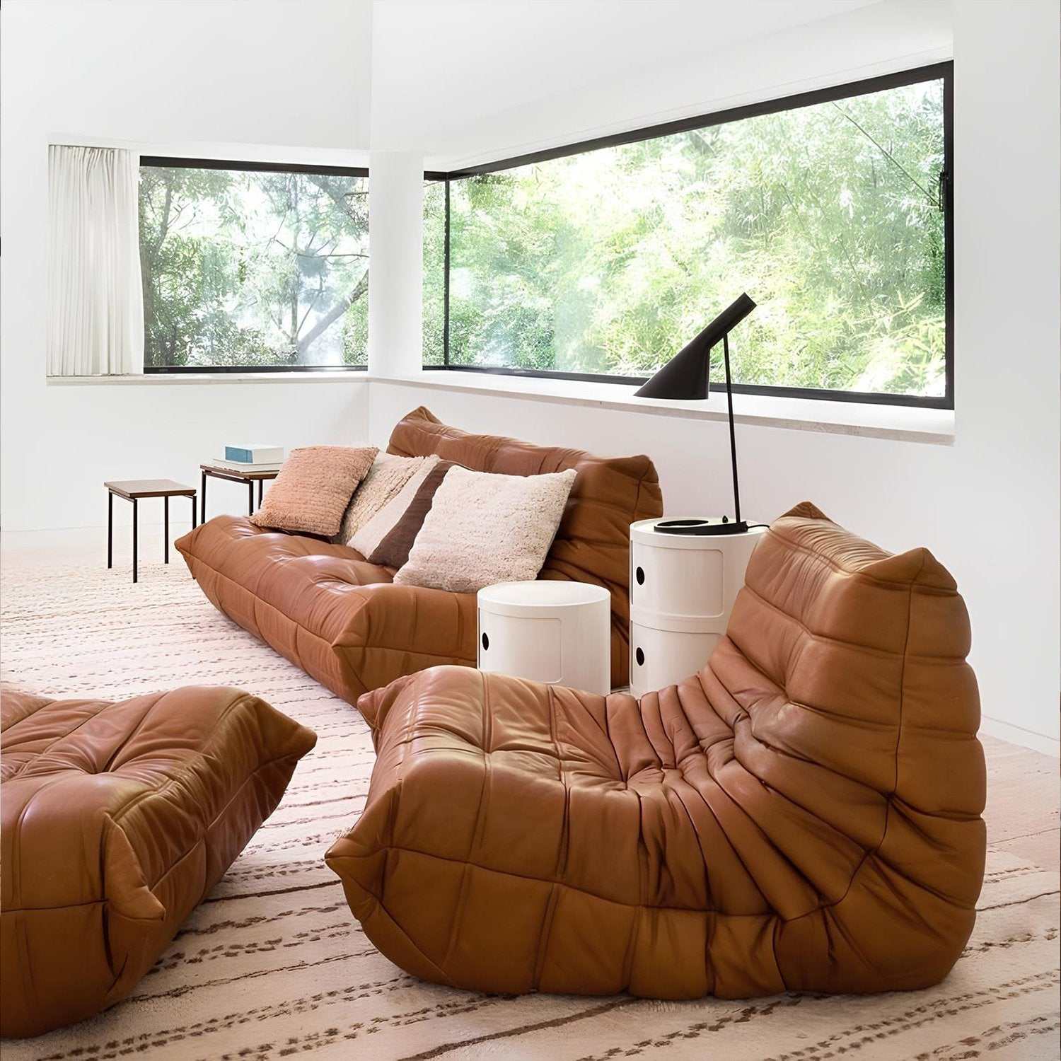 Caterpillar Lounge Chair and Footstool Set in cozy upholstered fabric with signature curved design