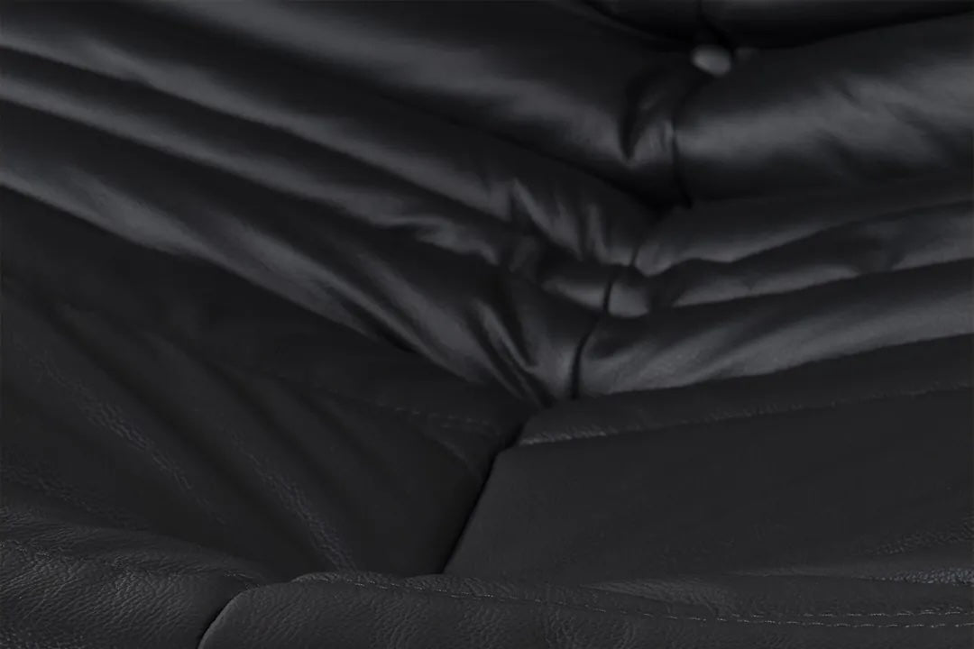 Caterpillar Lounge Chair and matching footstool set with upholstered all-foam construction and curved design