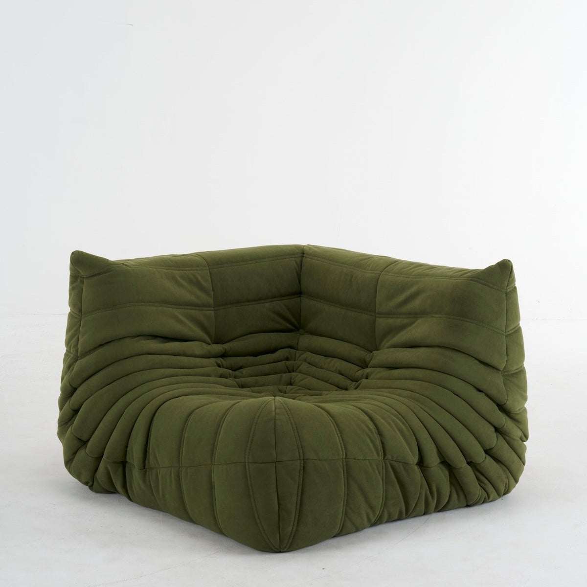 Modern suede corner sofa in L-shaped design with premium upholstery and spacious seating for living room