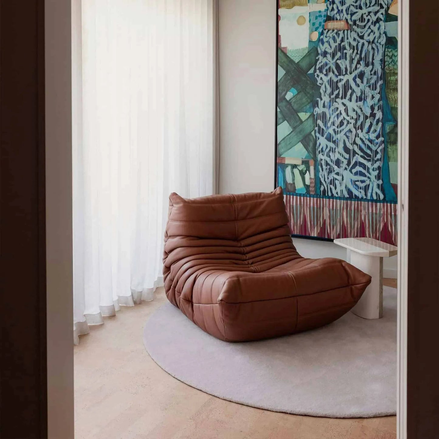 Caterpillar Fireside Chair leather armchair with frameless foam design and premium upholstery