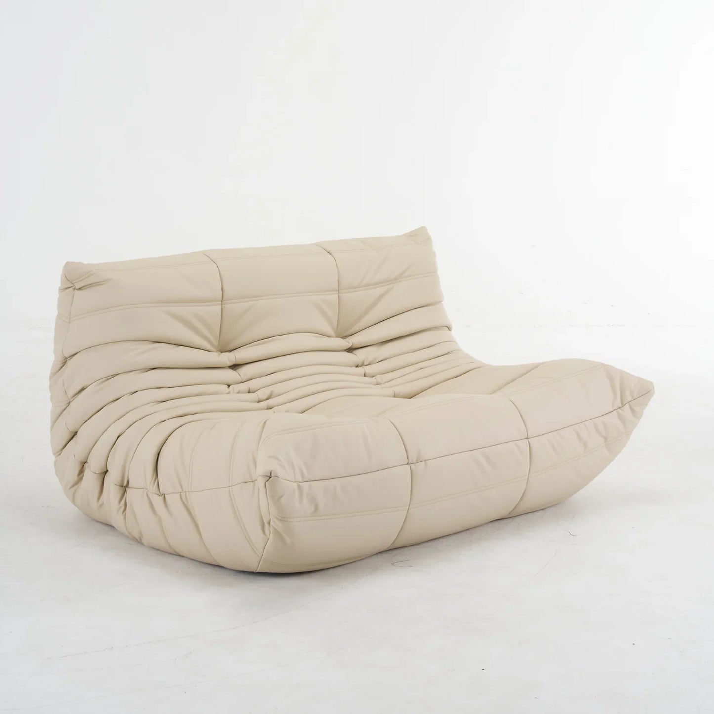 Plush leather loveseat sofa in dark blue with low-profile design and plush cushions