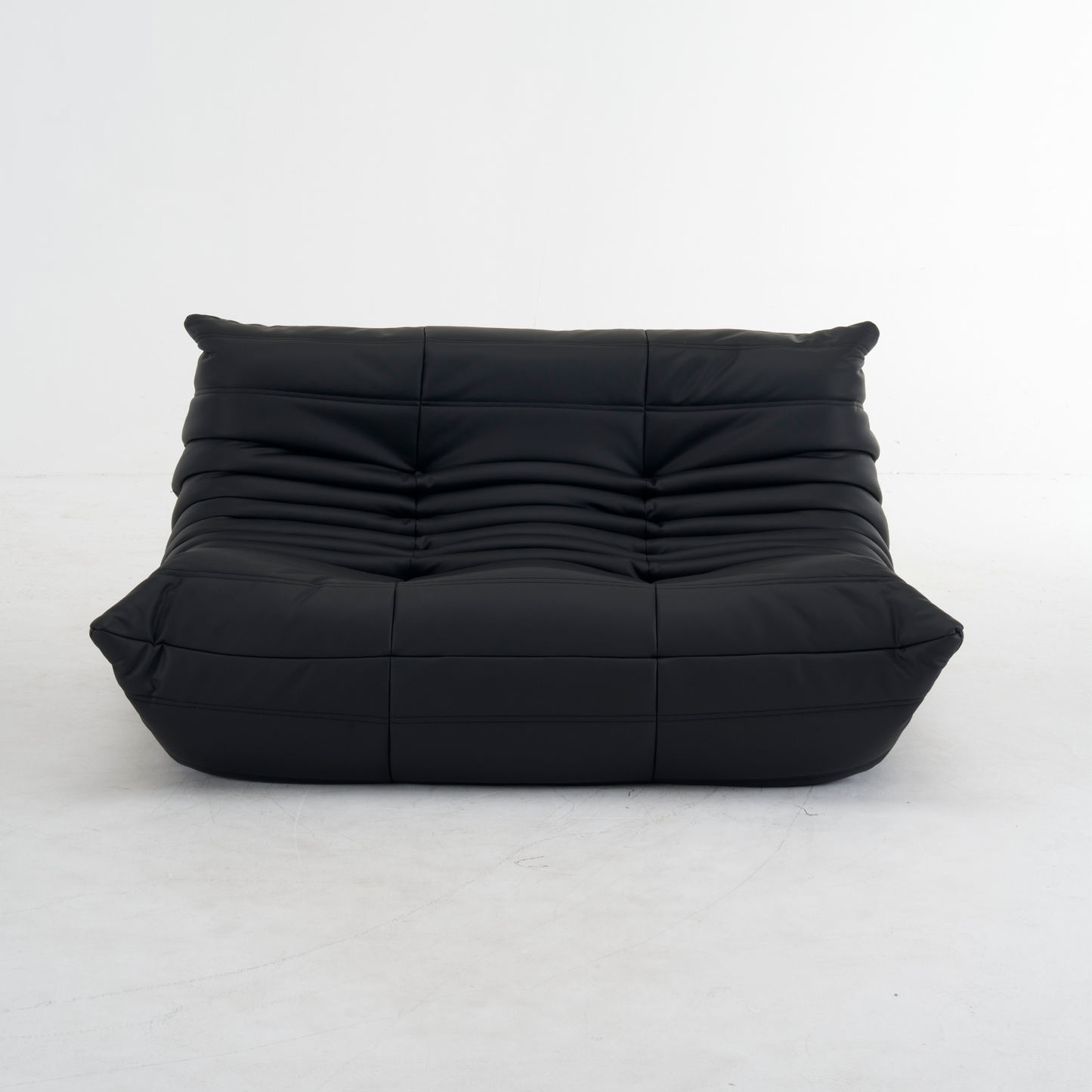 Plush leather loveseat sofa with low-profile design and deep cushions in premium top-grain leather