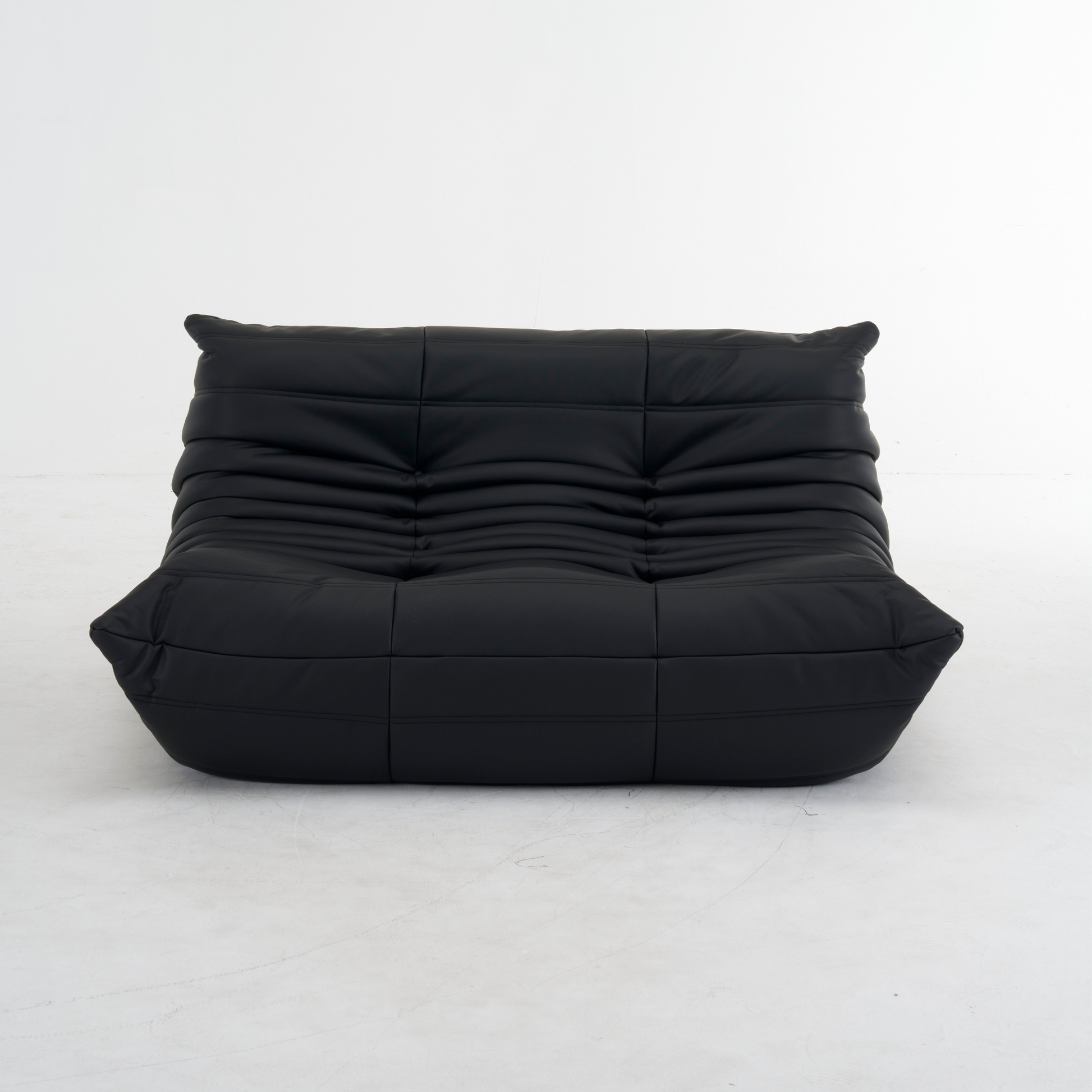 Plush leather loveseat sofa with low-profile design and deep cushions in premium top-grain leather