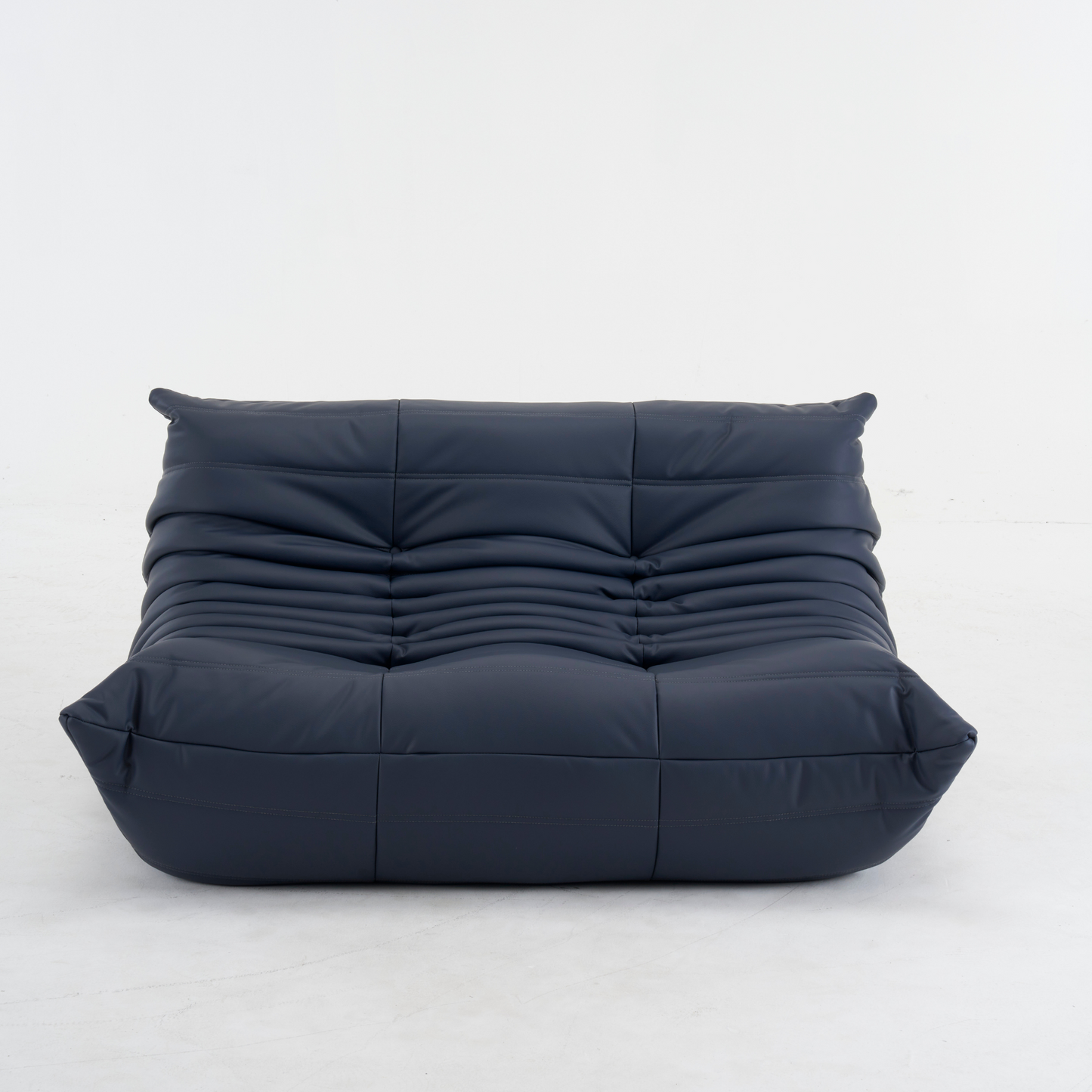 Plush leather loveseat sofa in low-profile design with deep cushions and premium top-grain leather upholstery
