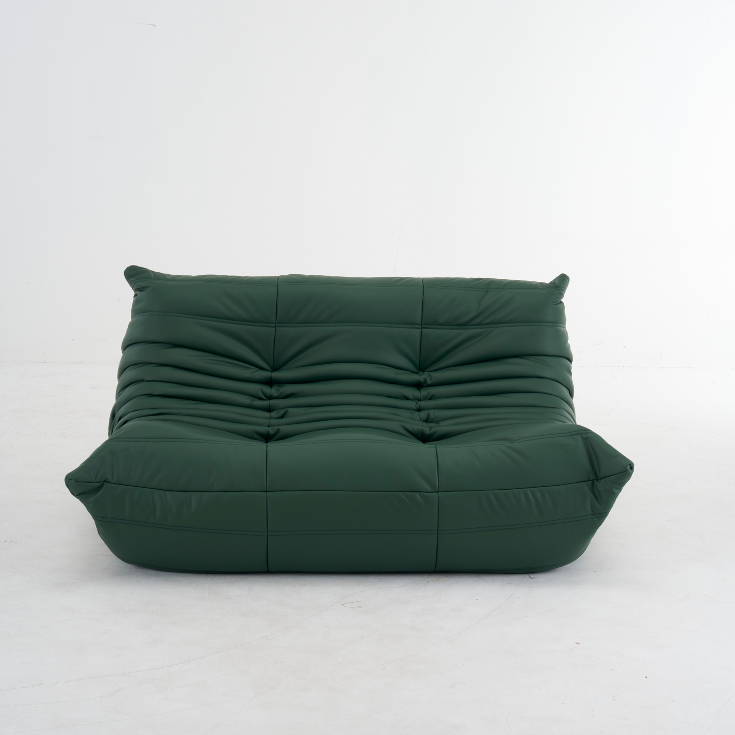 Plush leather loveseat sofa in dark blue with low-profile design and plush cushions