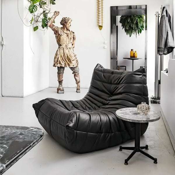 Modern Caterpillar Leather Lounge Chair with plush upholstered seat and wave-like frameless design in rich brown leather